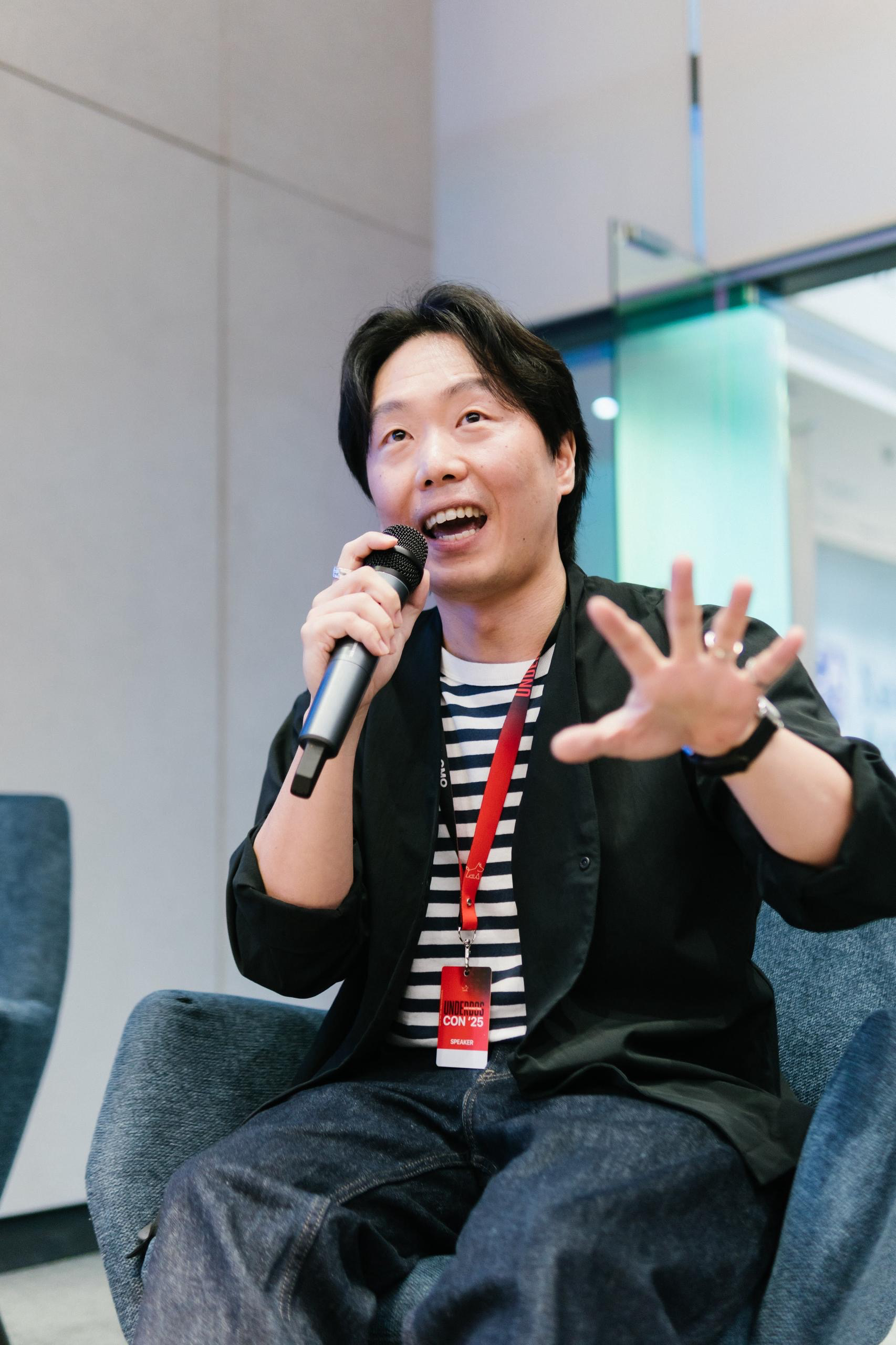 Derek Toh speaking to an audience during a public event.